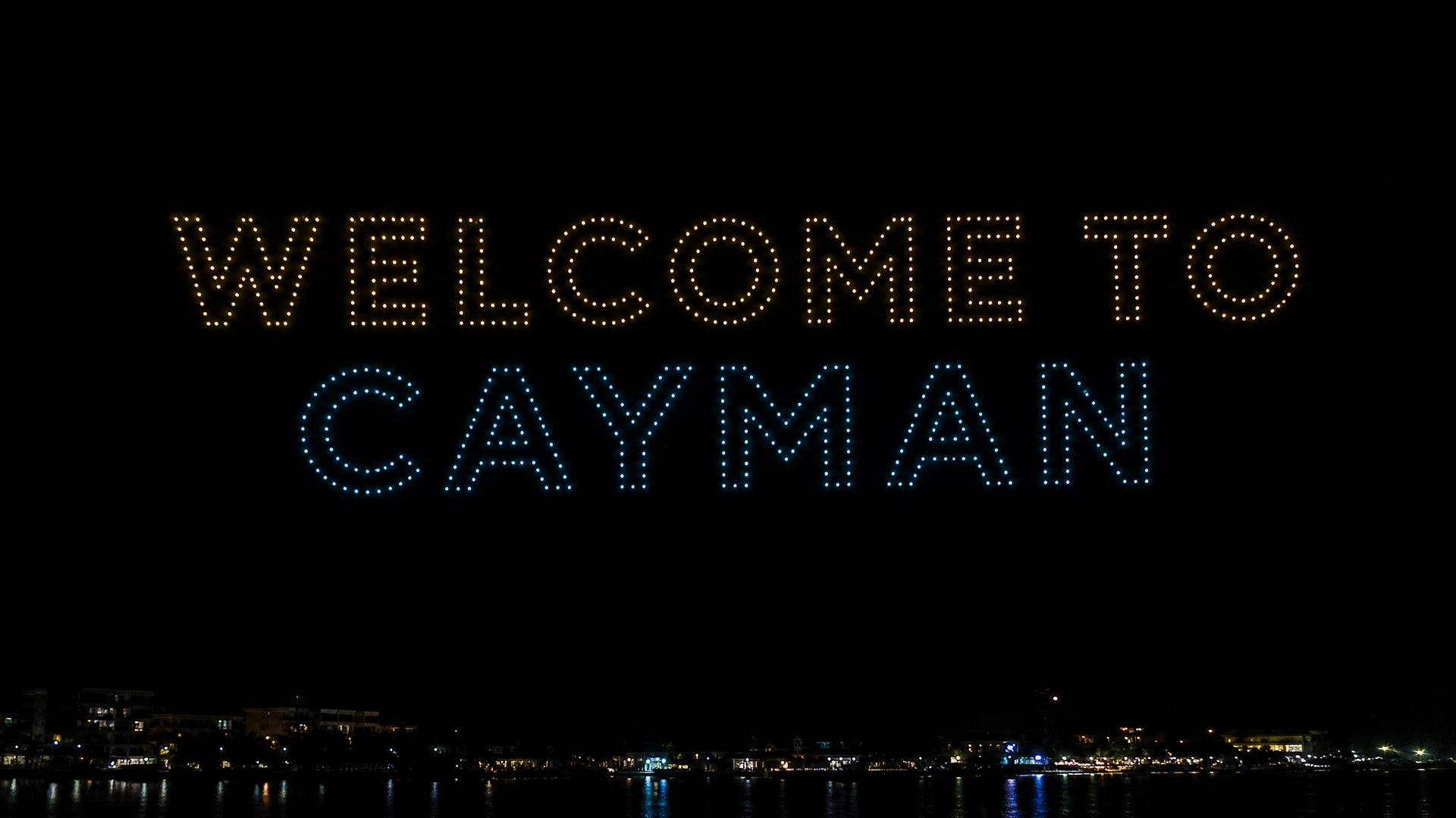 Welcome to Cayman lettering formed from points of light
