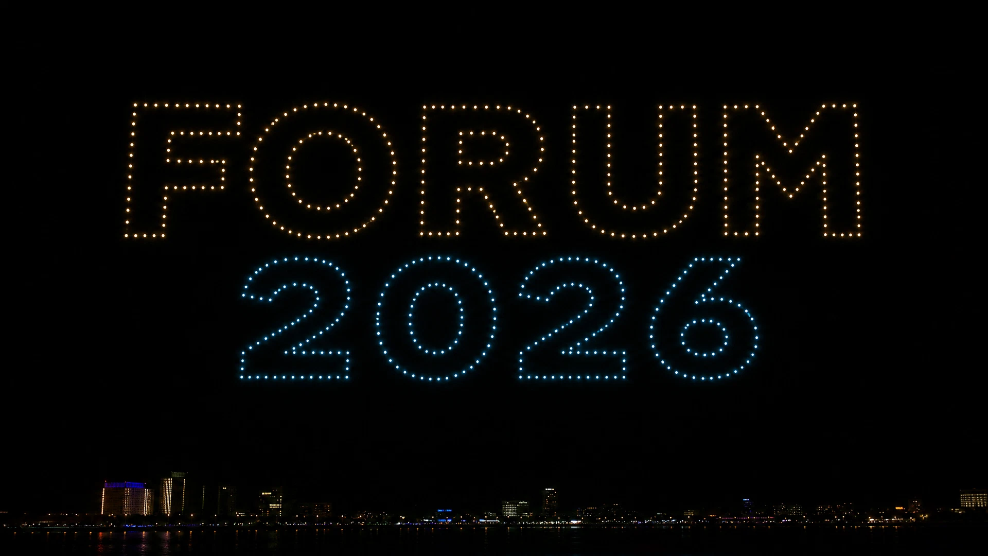 Forum 2026 lettering depicted in gold and blue lights