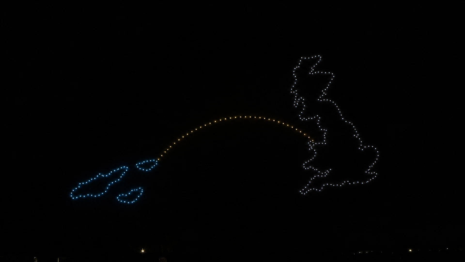 Cayman and Great Britain outlines connected by an arc of light