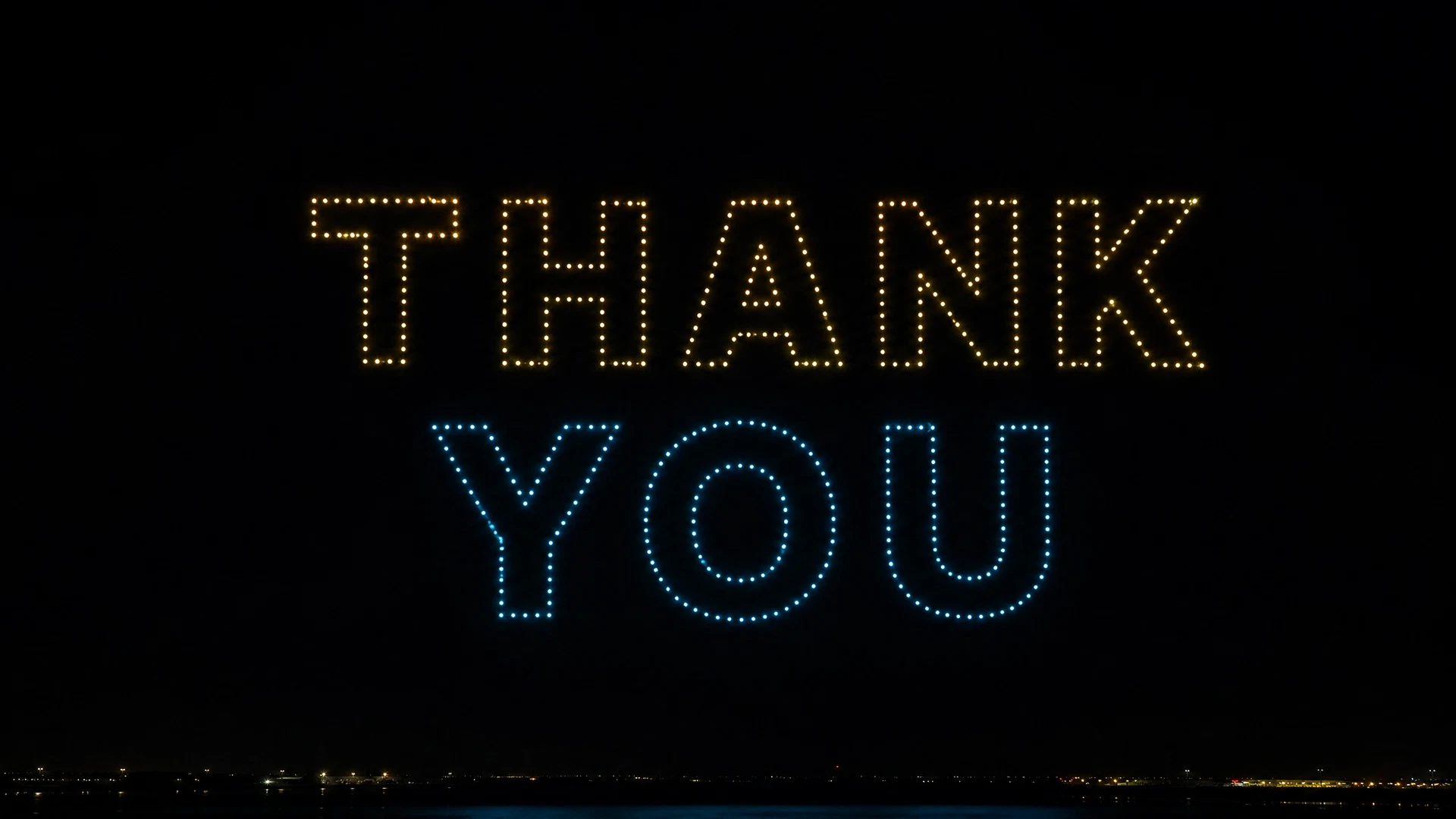 Thank You lettering formed from points of light
